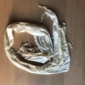 Cream colored scarf with stitching detail